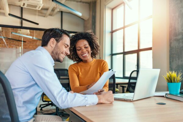 Two professionals observing email marketing reports