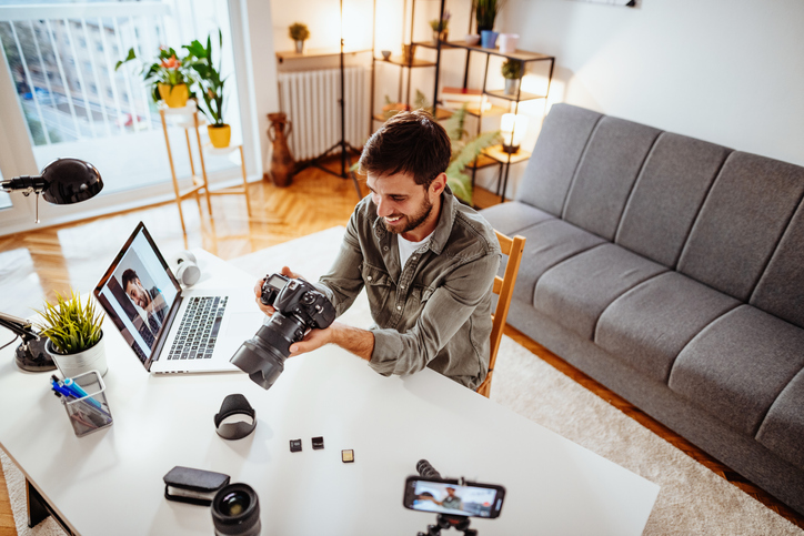 Vlogger preparing new equipment to upload image seo best practices